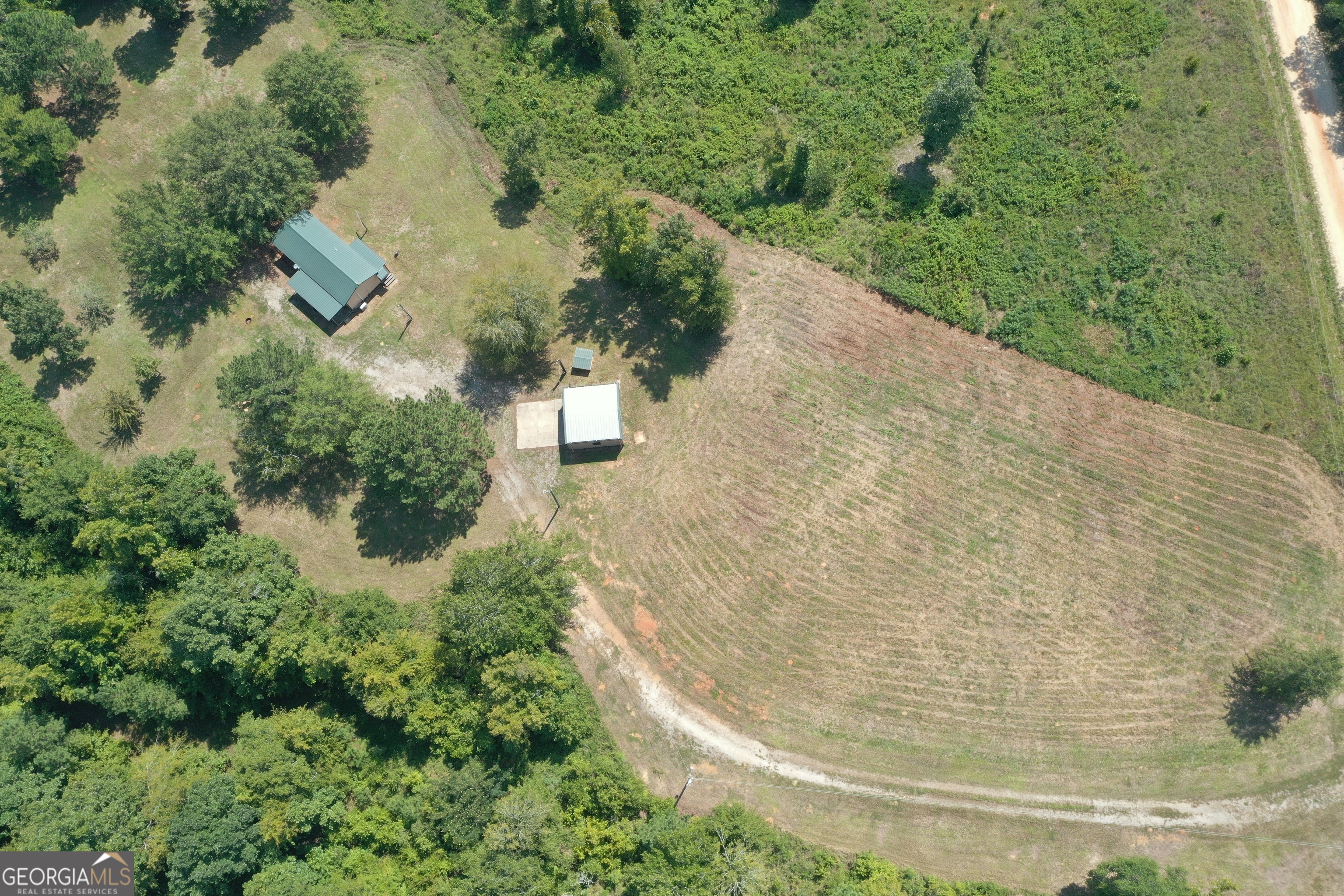 289 Hunting Club Road Southwest Crawfordville, GA 30631 - Photo 21 of 23 a view of a yard with plants