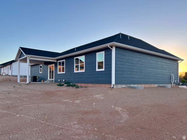 6 South 450th West Gunnison, UT 84634 - Photo 6 of 45 Contemporary ranch-style residence featuring deep blue siding and a dark shingle roof