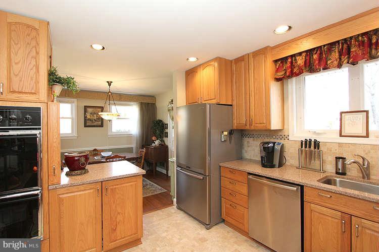 508 Derrydown Lane Silver Spring, MD 20904 - Photo 13 of 30 a kitchen with stainless steel appliances a refrigerator and a sink