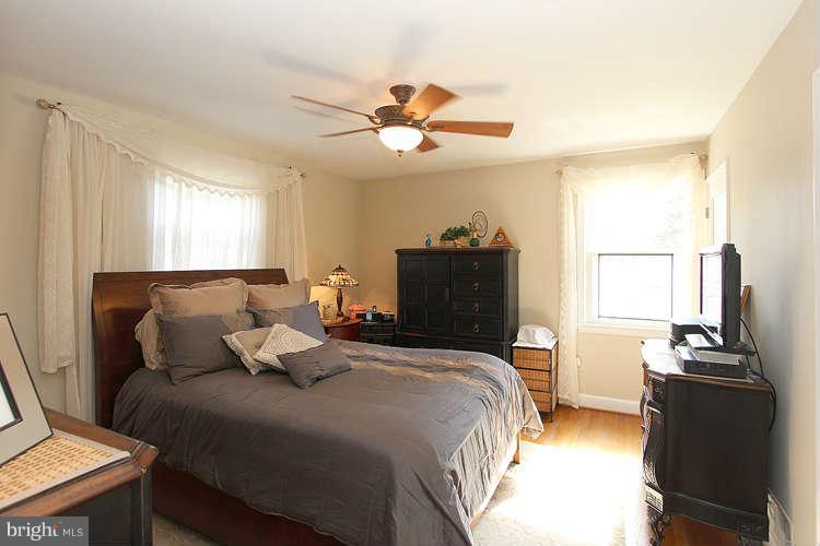 508 Derrydown Lane Silver Spring, MD 20904 - Photo 15 of 30 a bedroom with a bed and a flat tv screen
