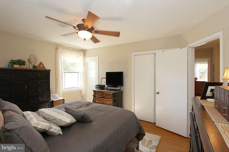508 Derrydown Lane Silver Spring, MD 20904 - Photo 16 of 30 a bedroom with a bed and a flat screen tv