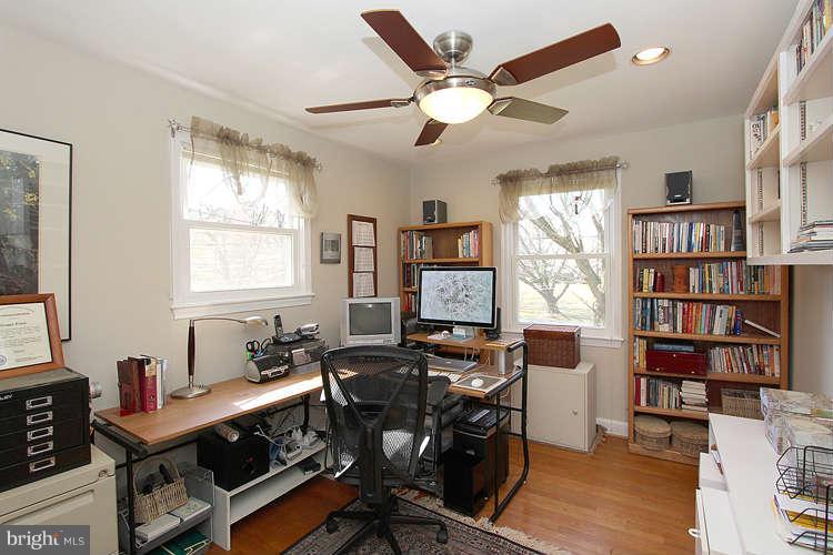 508 Derrydown Lane Silver Spring, MD 20904 - Photo 19 of 30 a work room with furniture a bookshelf and a window