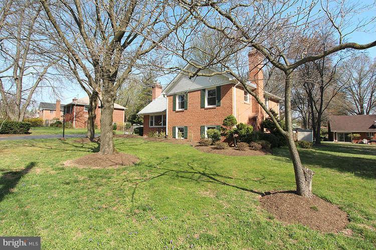 508 Derrydown Lane Silver Spring, MD 20904 - Photo 3 of 30 a view of a yard with a house in the background