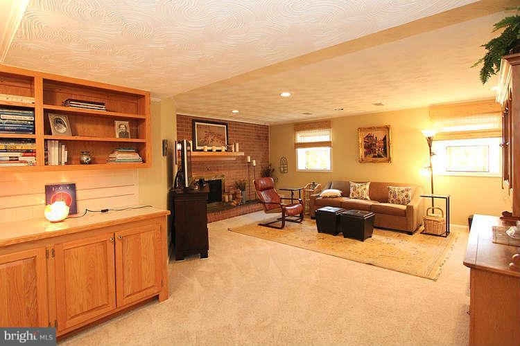 508 Derrydown Lane Silver Spring, MD 20904 - Photo 22 of 30 a living room with furniture a window and a flat screen tv