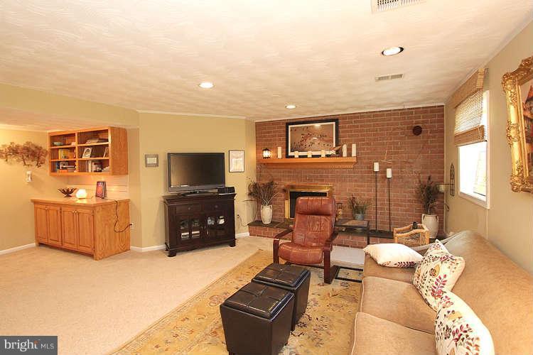 508 Derrydown Lane Silver Spring, MD 20904 - Photo 23 of 30 a living room with furniture and a flat screen tv
