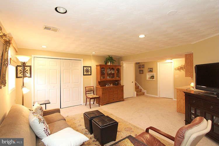 508 Derrydown Lane Silver Spring, MD 20904 - Photo 24 of 30 a bedroom with furniture and a flat screen tv