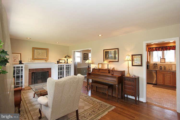 508 Derrydown Lane Silver Spring, MD 20904 - Photo 4 of 30 a living room with furniture a fireplace and wooden floor