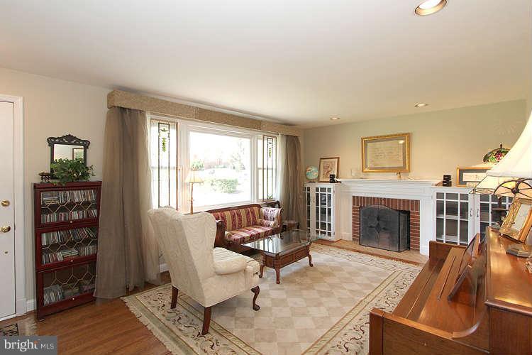 508 Derrydown Lane Silver Spring, MD 20904 - Photo 5 of 30 a living room with furniture and a fireplace