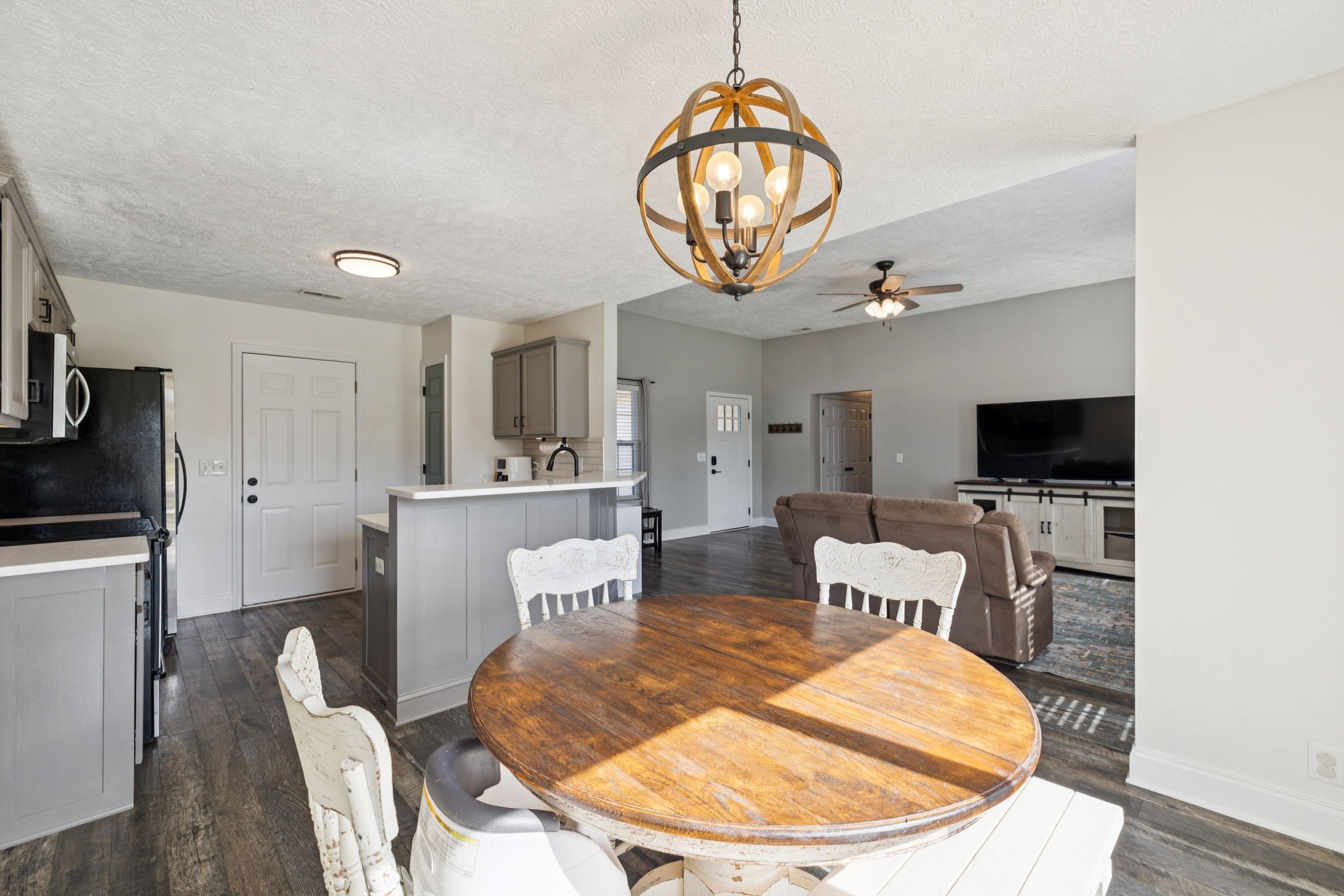 1169 Mantle Way Murfreesboro, TN 37129 - Photo 13 of 45 a view of a livingroom with furniture and a kitchen view