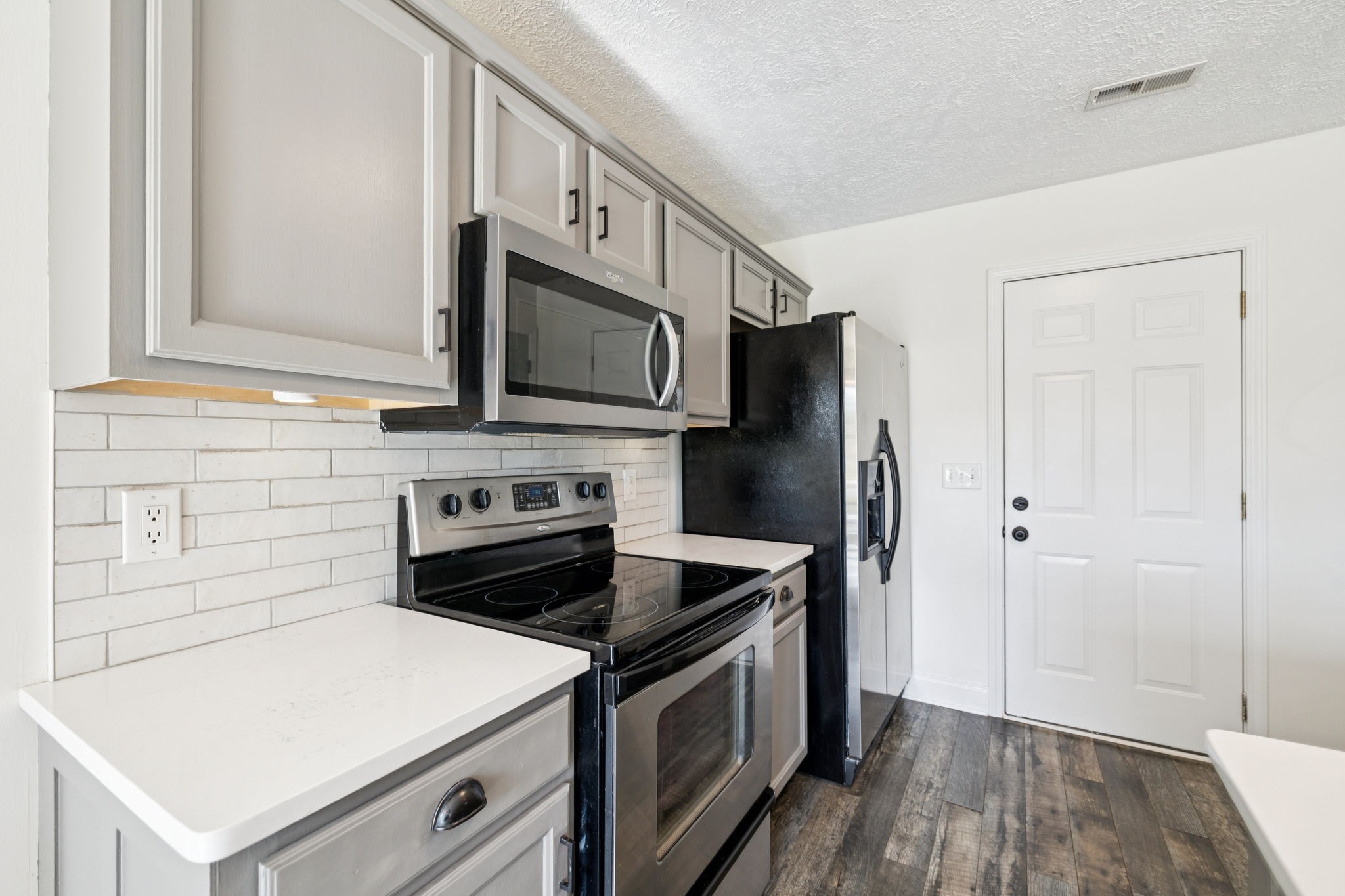 1169 Mantle Way Murfreesboro, TN 37129 - Photo 15 of 45 a kitchen with a stove microwave and refrigerator