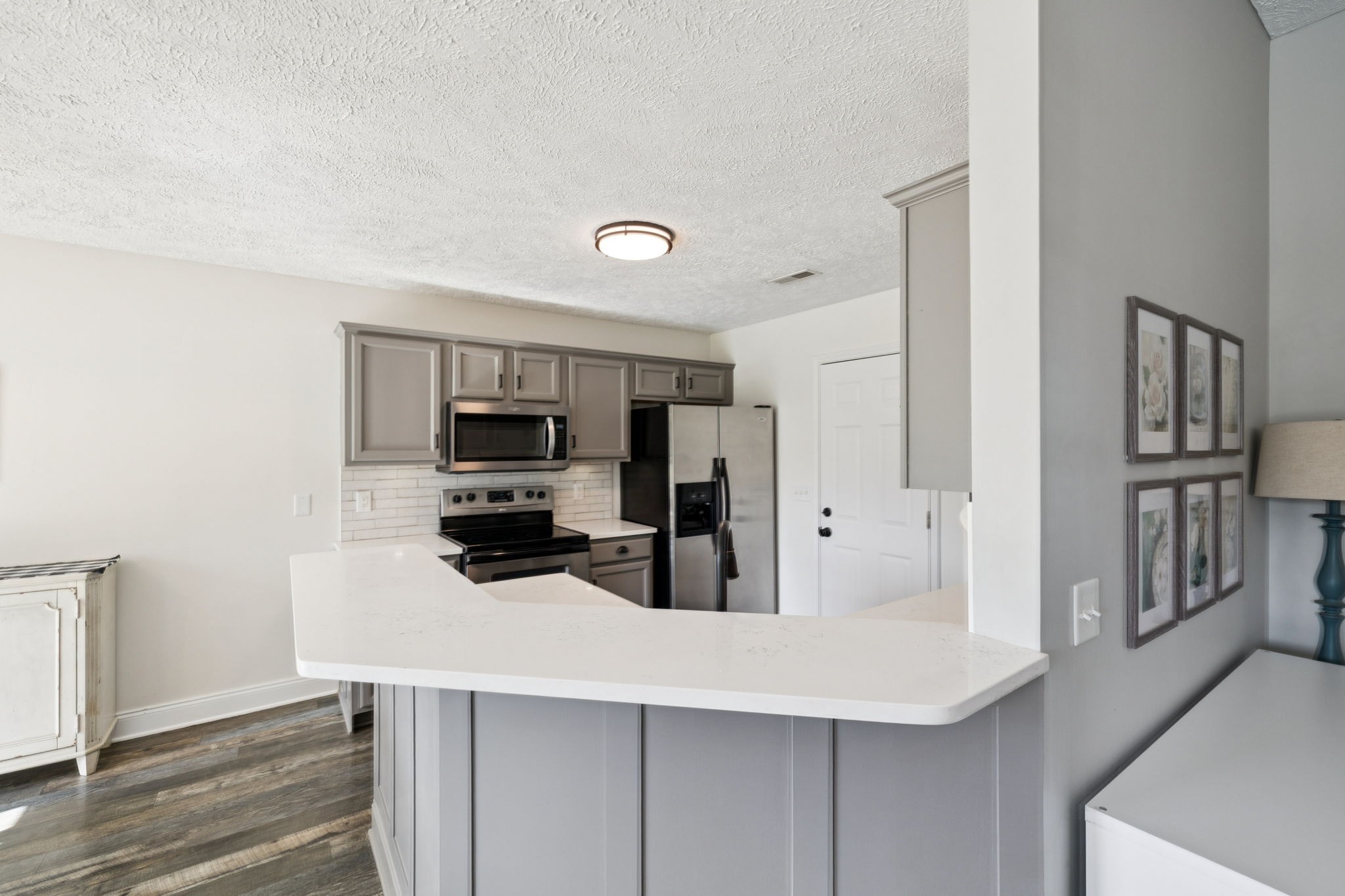 1169 Mantle Way Murfreesboro, TN 37129 - Photo 16 of 45 a kitchen with stainless steel appliances a refrigerator and cabinets