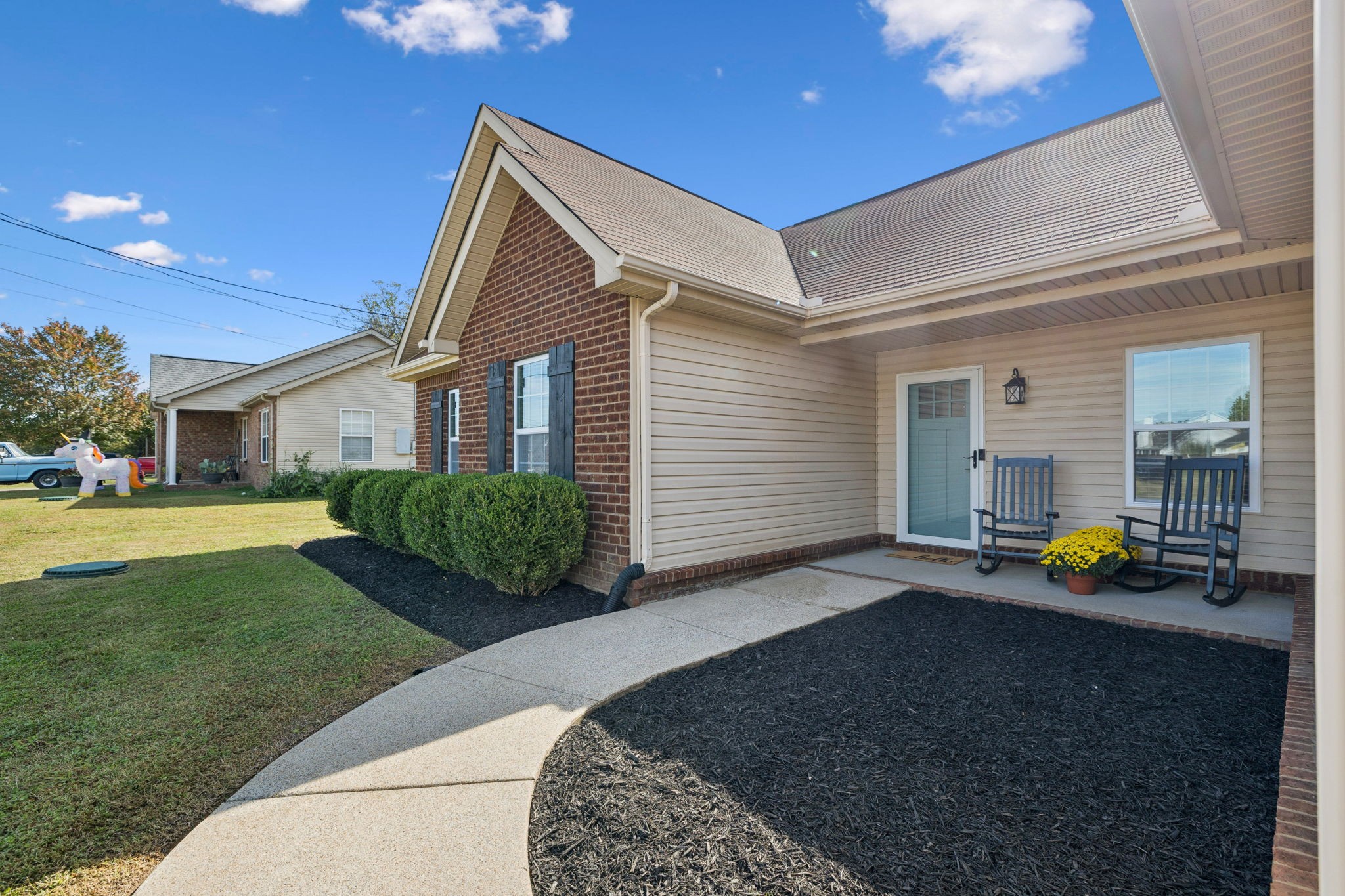 1169 Mantle Way Murfreesboro, TN 37129 - Photo 4 of 45 a front view of a house with a garden and porch