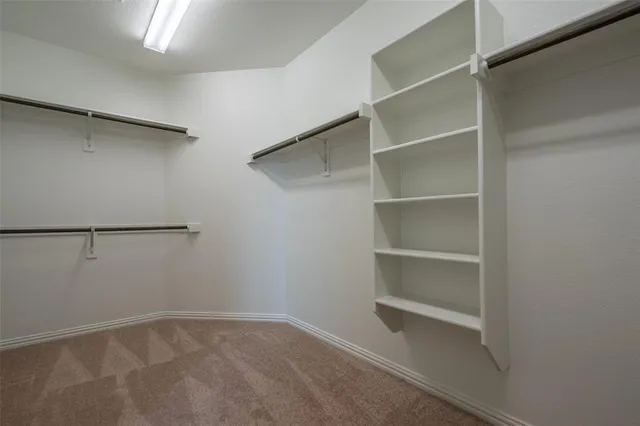 a view of an empty walk in closet