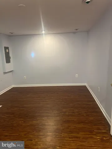 a view of room with wooden floor