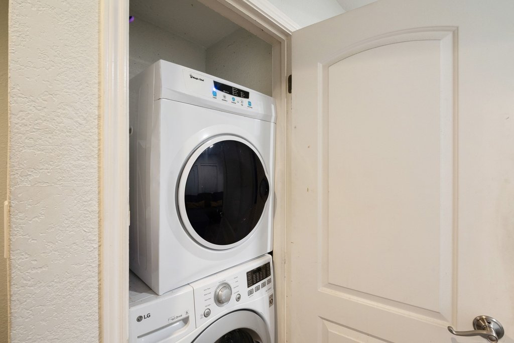 1910 Robbins Place, Unit 106 Austin, TX 78705 - Photo 17 of 20 a utility room with dryer and washer