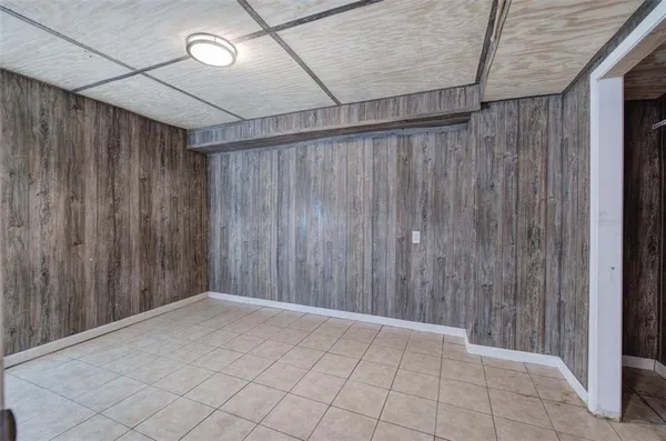 a view of entryway with wooden walls