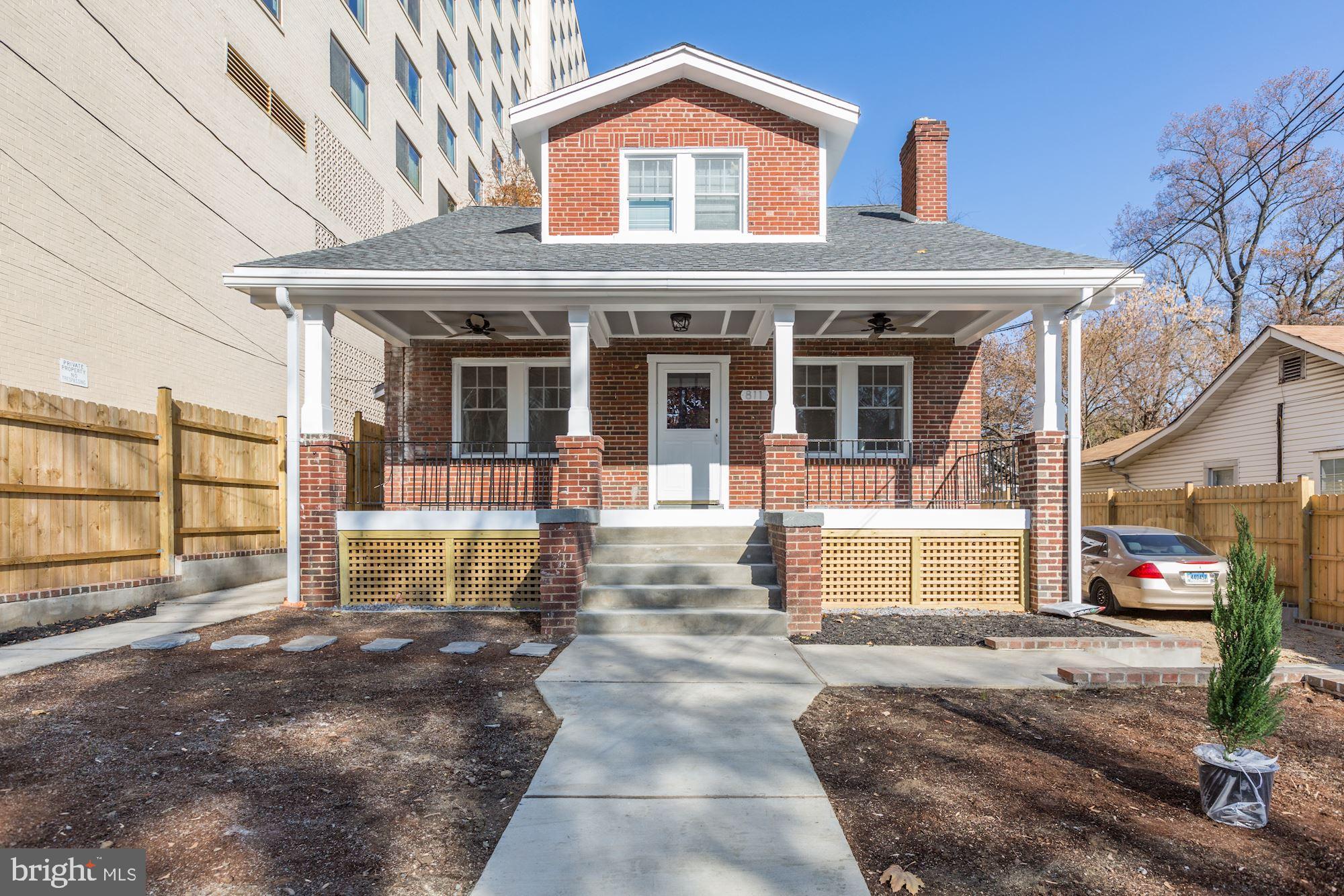 811 Thayer Avenue, Unit 1 Silver Spring, MD 20910 - Photo 1 of 34 a front view of a house with a yard
