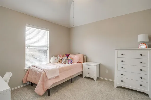 a bathroom with a granite countertop sink mirror and a bathtub