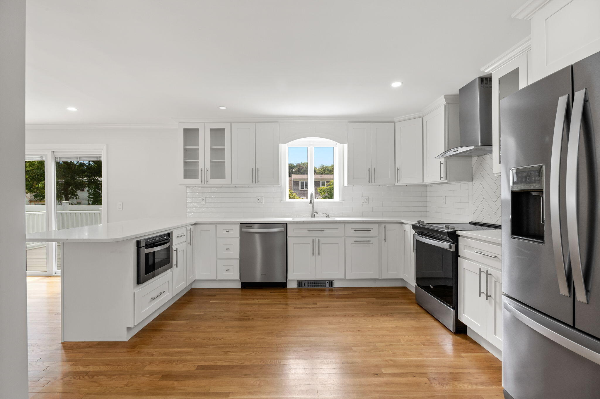 28 Vandermint Lane Hyannis, MA 02601 - Photo 15 of 47 a kitchen with stainless steel appliances a refrigerator sink and stove top oven