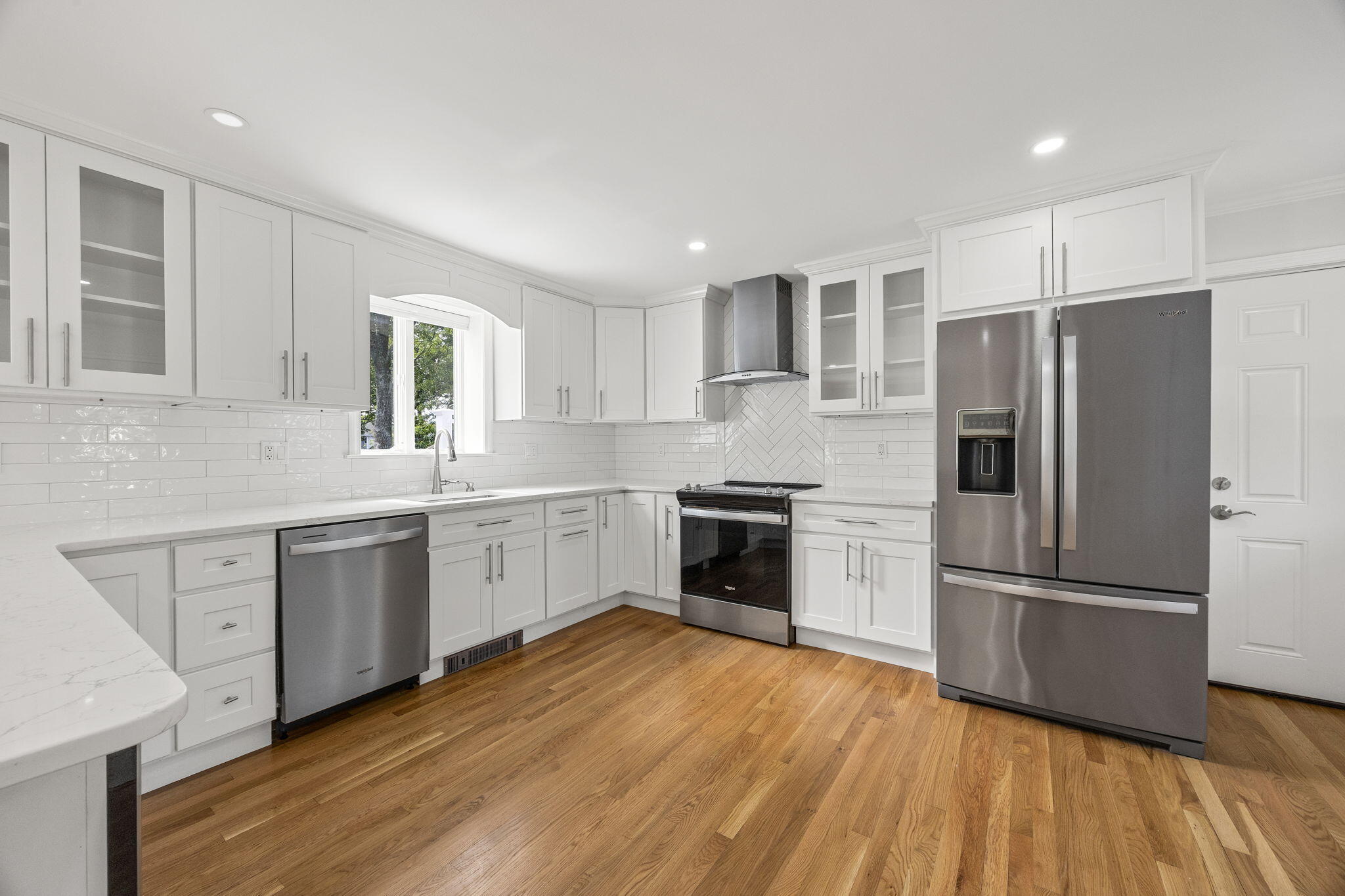 28 Vandermint Lane Hyannis, MA 02601 - Photo 16 of 47 a kitchen with a refrigerator wooden floor a sink and a stove