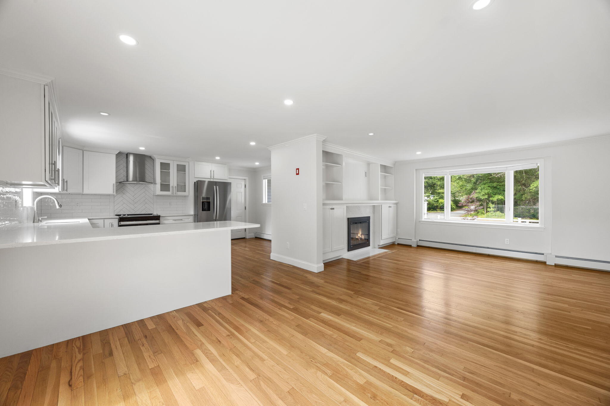 28 Vandermint Lane Hyannis, MA 02601 - Photo 19 of 47 a view of an empty room with kitchen and window