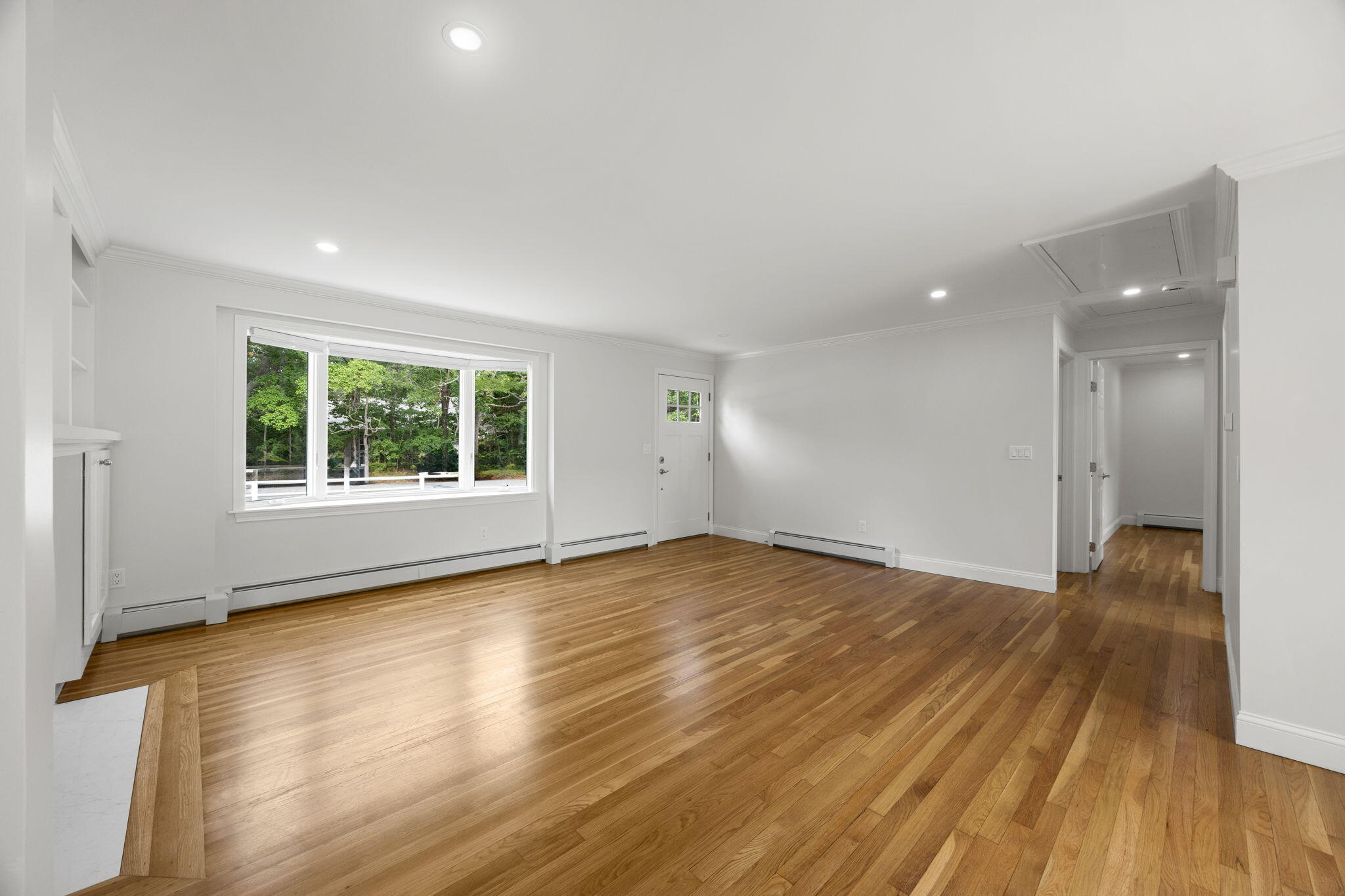 28 Vandermint Lane Hyannis, MA 02601 - Photo 20 of 47 an empty room with wooden floor and windows