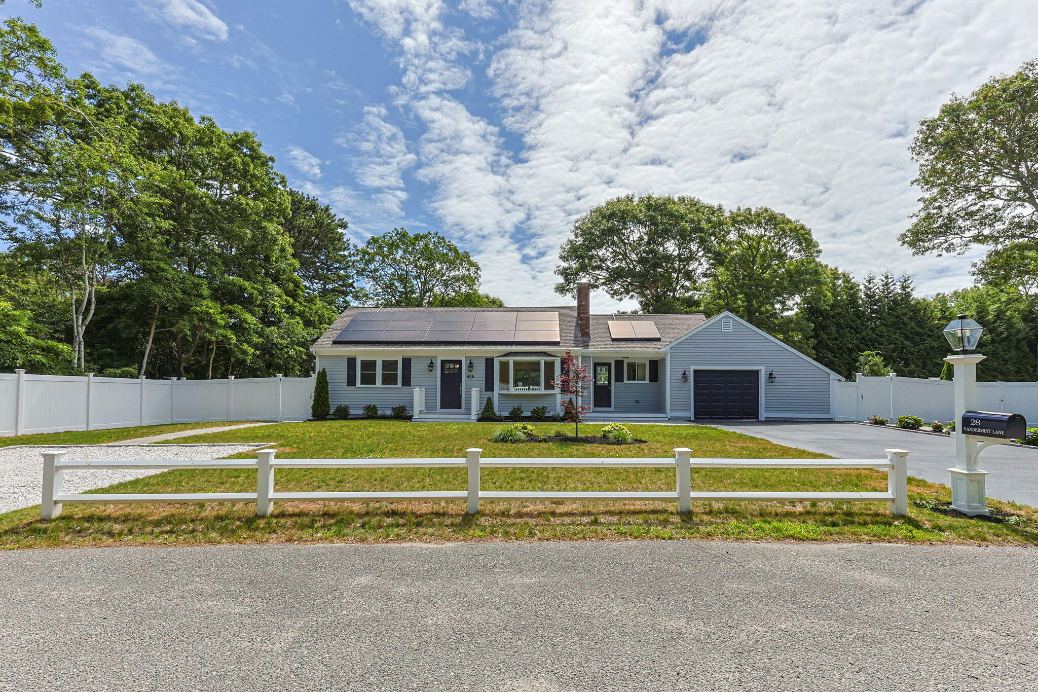 28 Vandermint Lane Hyannis, MA 02601 - Photo 2 of 47 a front view of a house with a yard