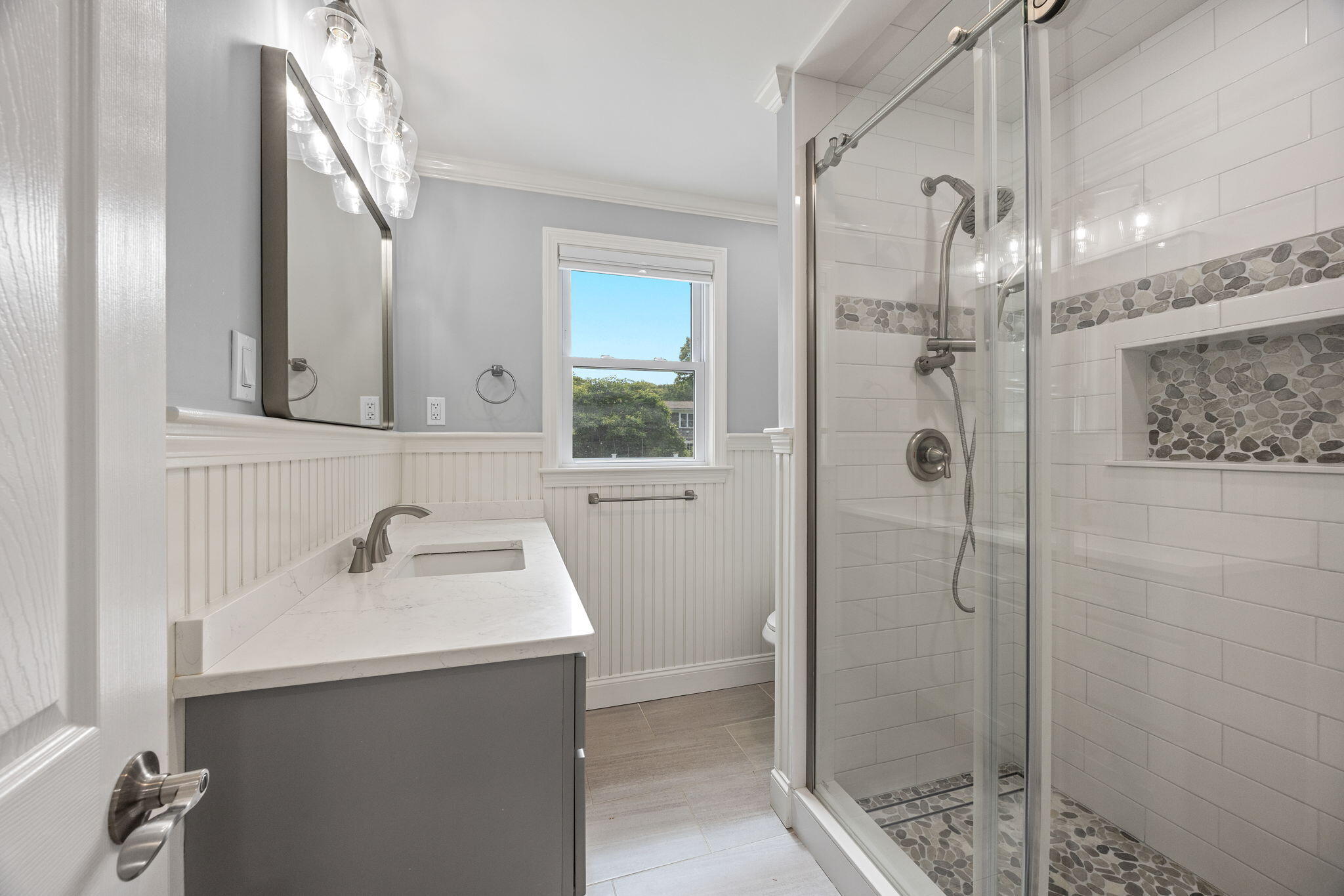 28 Vandermint Lane Hyannis, MA 02601 - Photo 21 of 47 a bathroom with a sink a mirror and shower