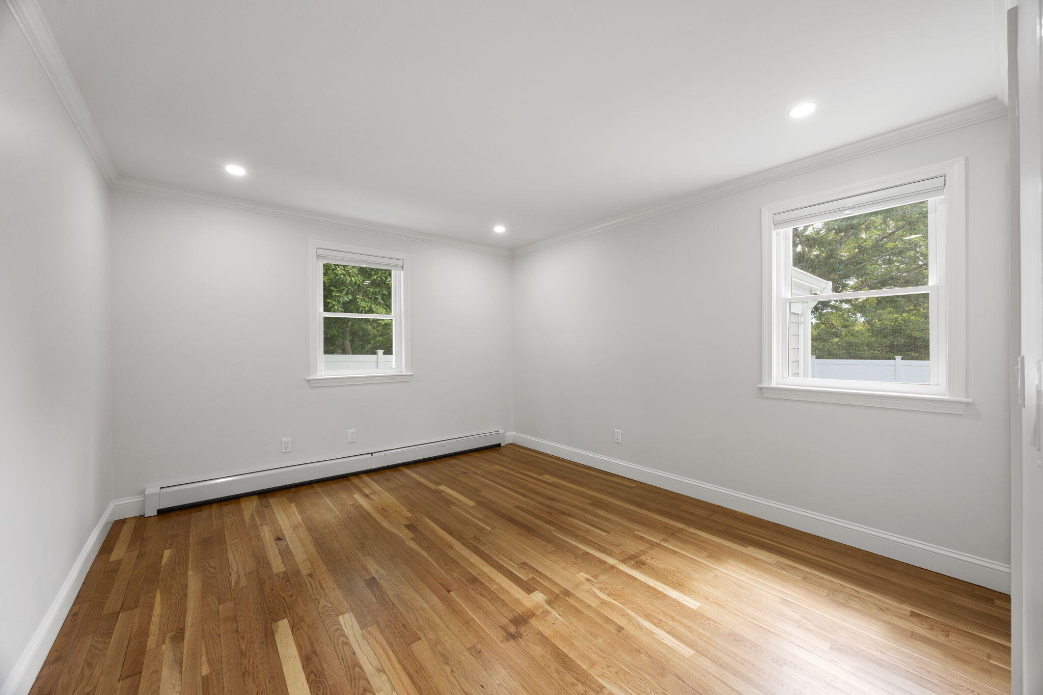 28 Vandermint Lane Hyannis, MA 02601 - Photo 22 of 47 a view of an empty room with wooden floor and a window