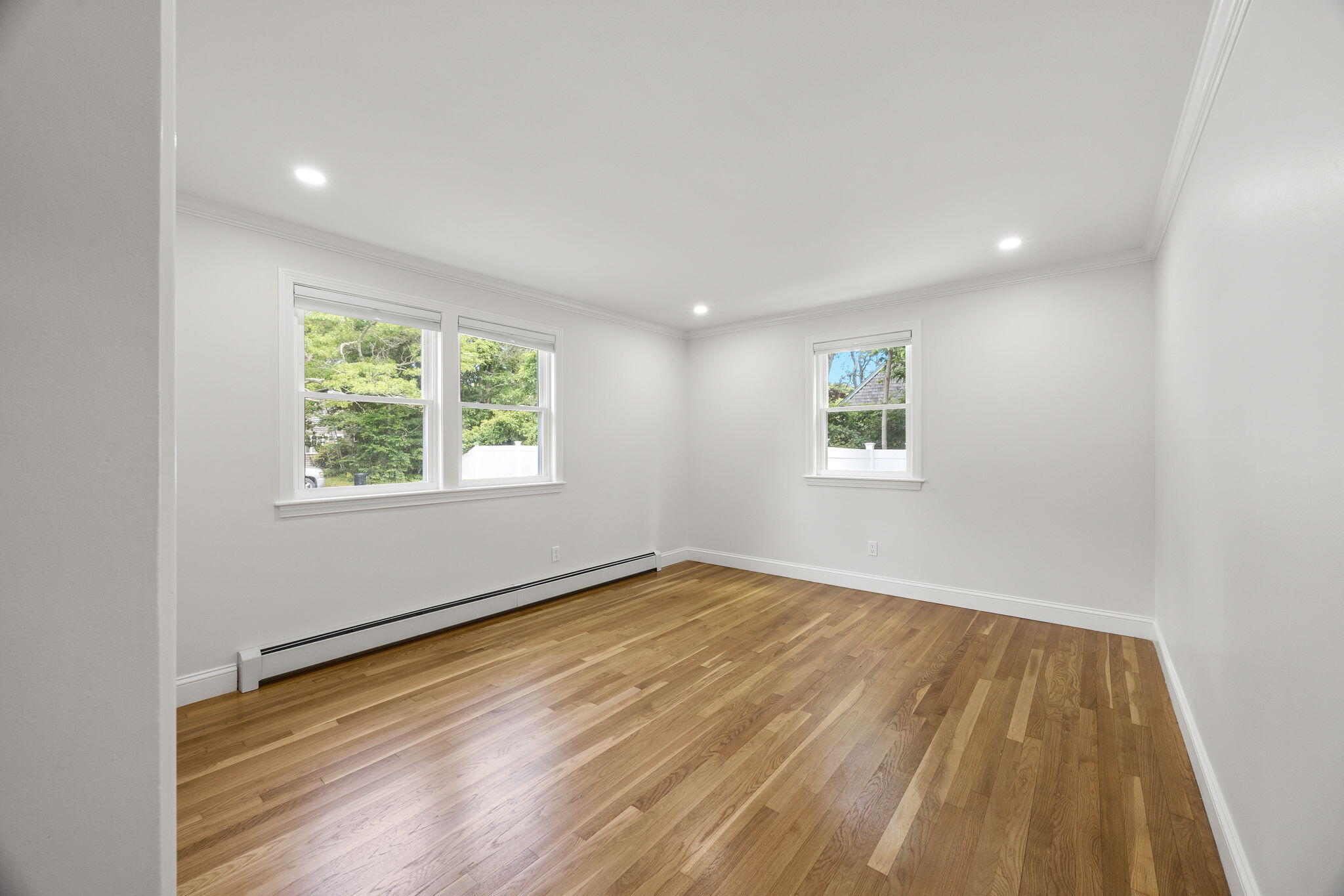 28 Vandermint Lane Hyannis, MA 02601 - Photo 24 of 47 an empty room with wooden floor and windows