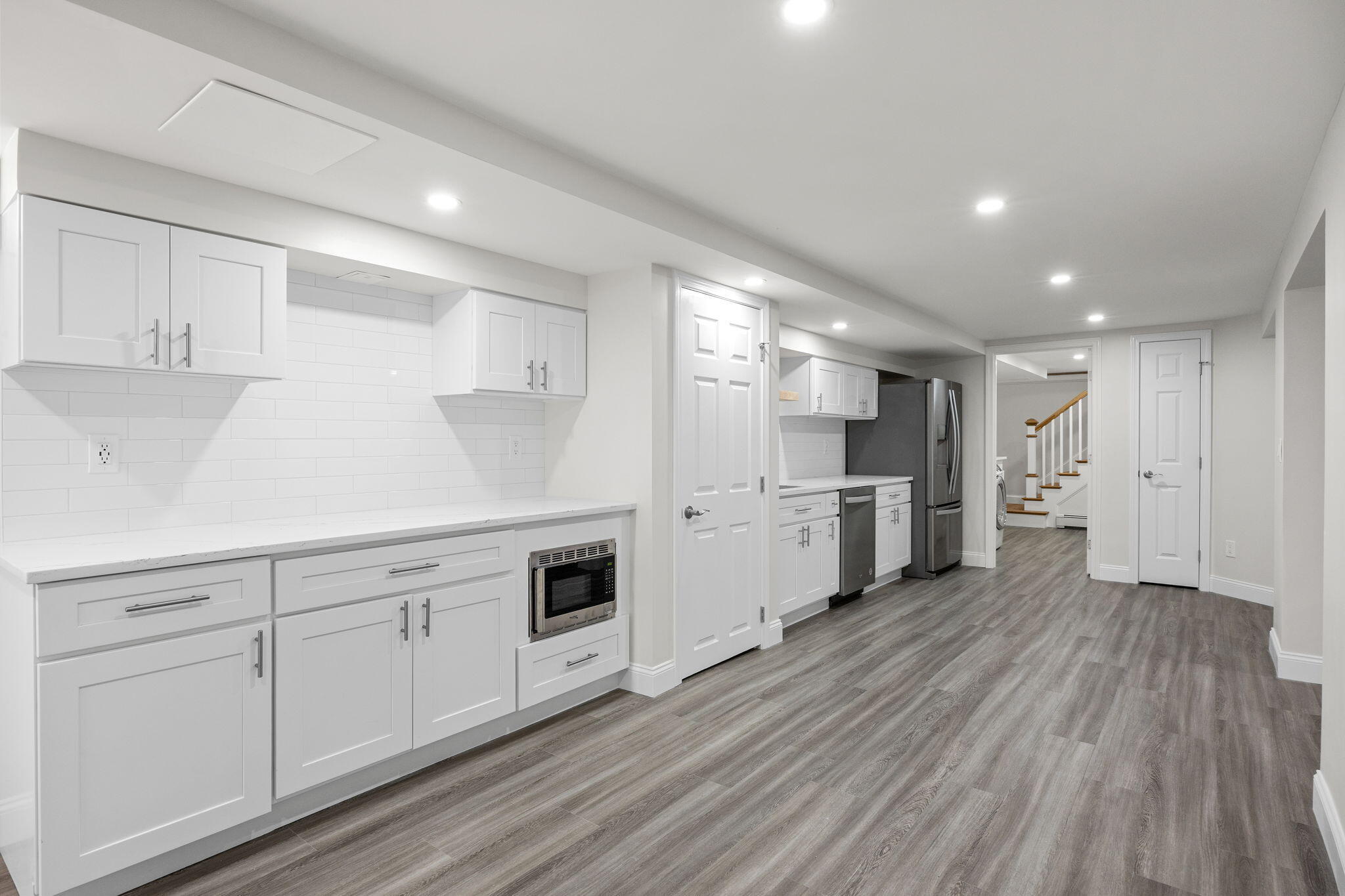 28 Vandermint Lane Hyannis, MA 02601 - Photo 31 of 47 a kitchen with white cabinets and white appliances