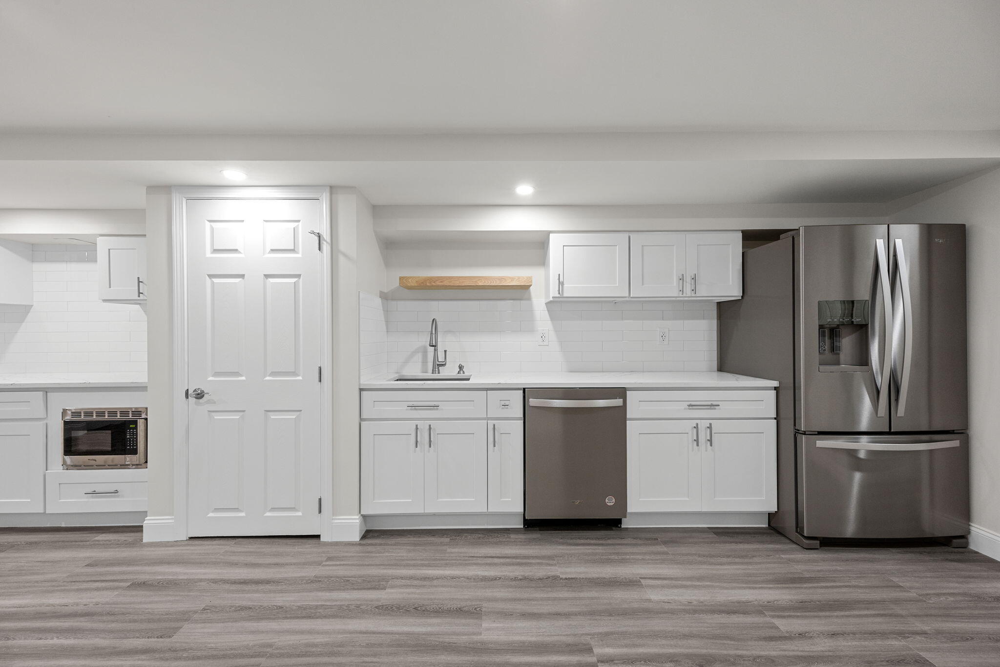 28 Vandermint Lane Hyannis, MA 02601 - Photo 32 of 47 a kitchen with white cabinets and stainless steel appliances