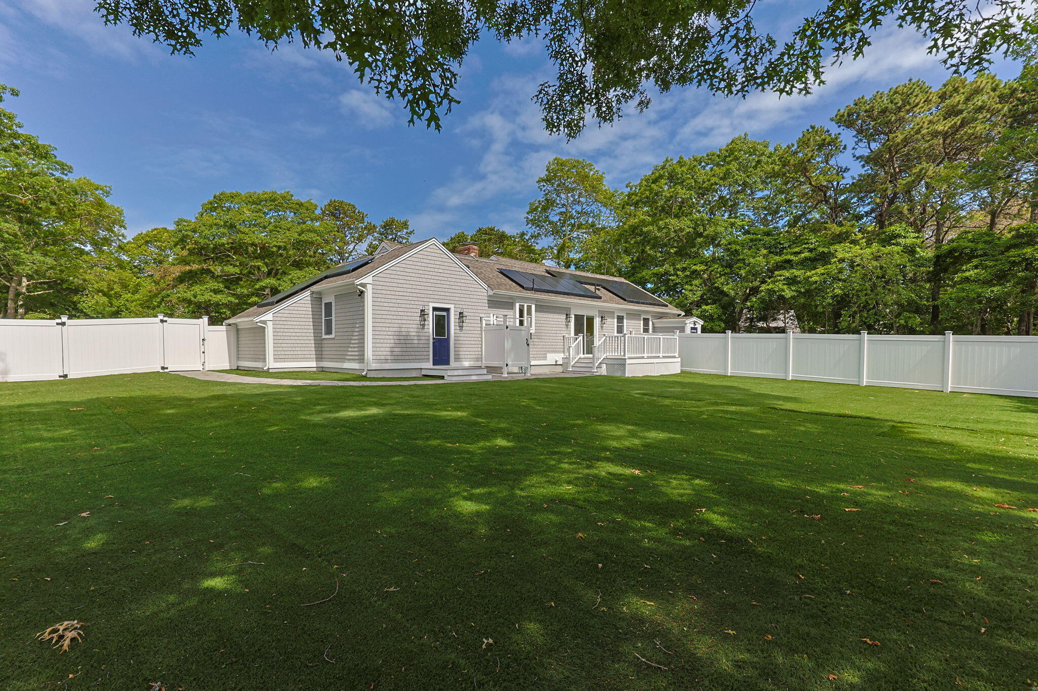28 Vandermint Lane Hyannis, MA 02601 - Photo 39 of 47 a view of white house with a big yard and large trees