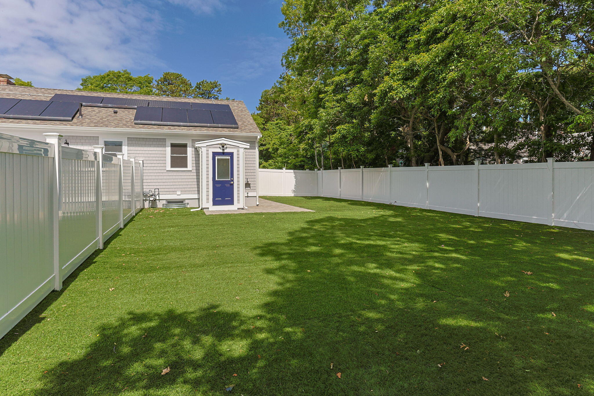 28 Vandermint Lane Hyannis, MA 02601 - Photo 41 of 47 a view of a yard in front of a house with a large tree