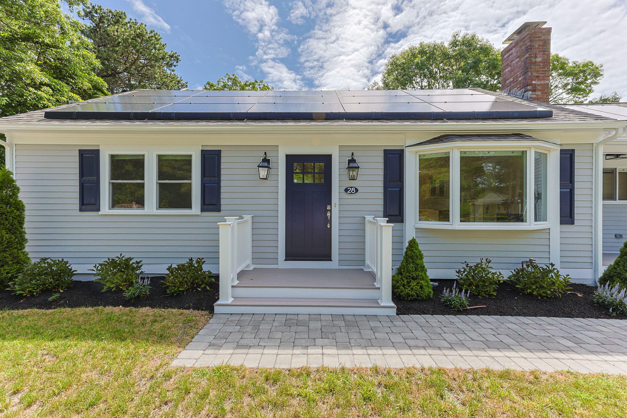 28 Vandermint Lane Hyannis, MA 02601 - Photo 7 of 47 a front view of a house with a yard