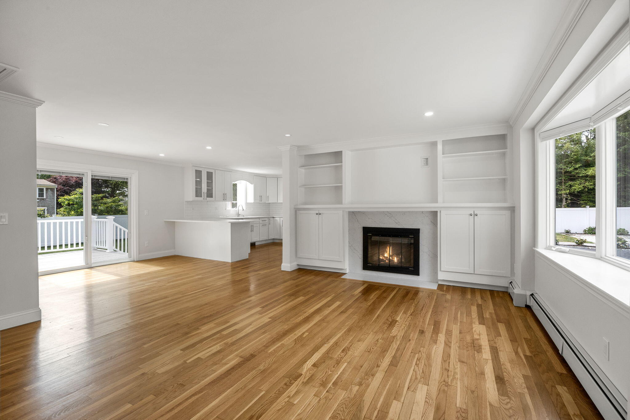 28 Vandermint Lane Hyannis, MA 02601 - Photo 10 of 47 a view of a livingroom with wooden floor and a fireplace