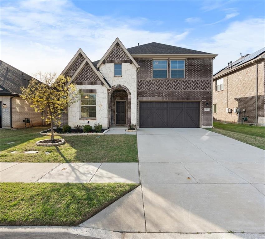 4539 Longfellow Avenue Aubrey, TX 76227 - Photo 1 of 1 a front view of a house with a yard