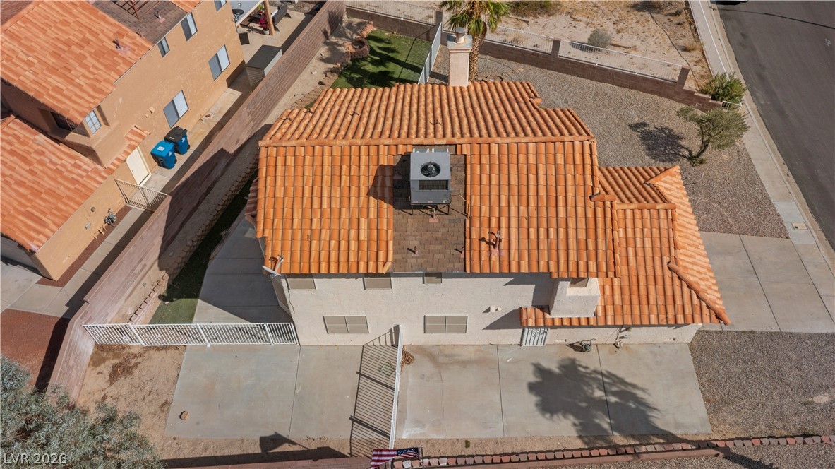 3156 Terrace View Drive Laughlin, NV 89029 - Photo 90 of 94 An aerial perspective reveals the home's tiled roof and practical paved outdoor areas.