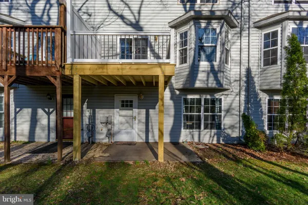 a view of house with front door and porch
