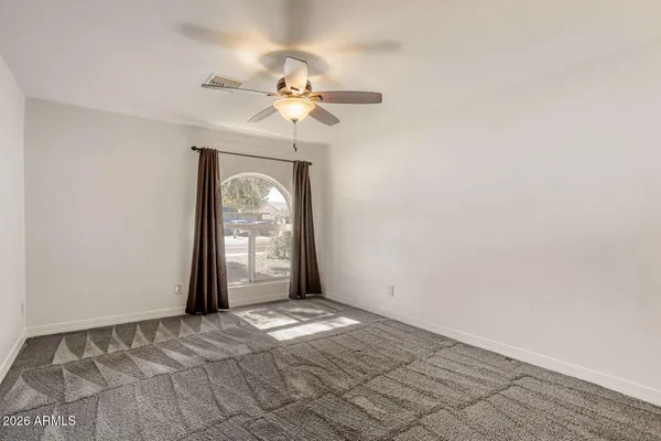 a bathroom with a granite countertop toilet a sink and a bathtub