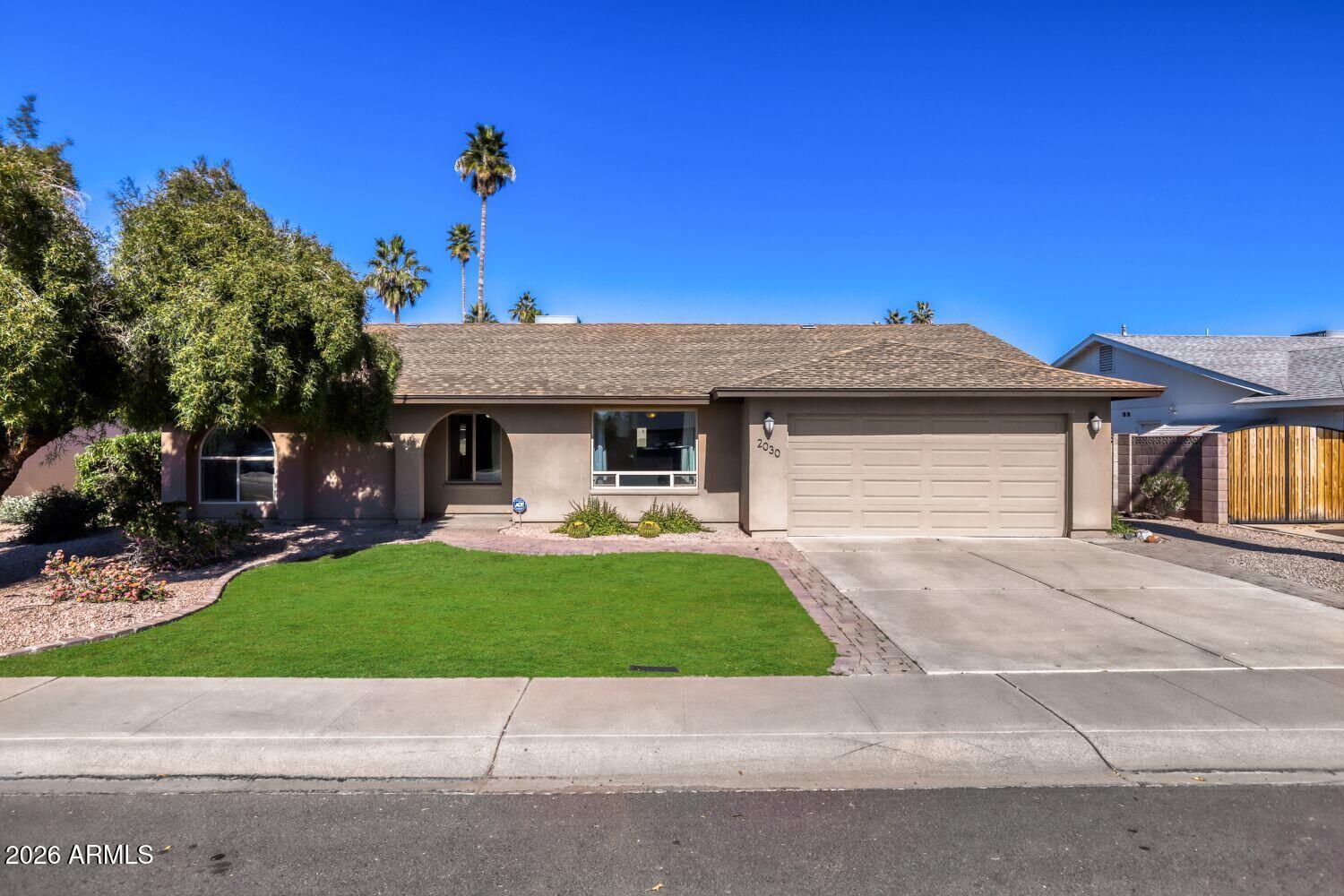 2030 East Colgate Drive Tempe, AZ 85283 - Photo 2 of 26 a view of a house with a yard