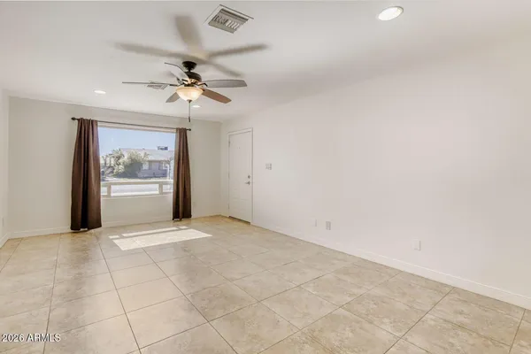 a view of an empty room with a window