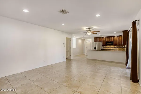 a view of a kitchen with a sink and cabinets