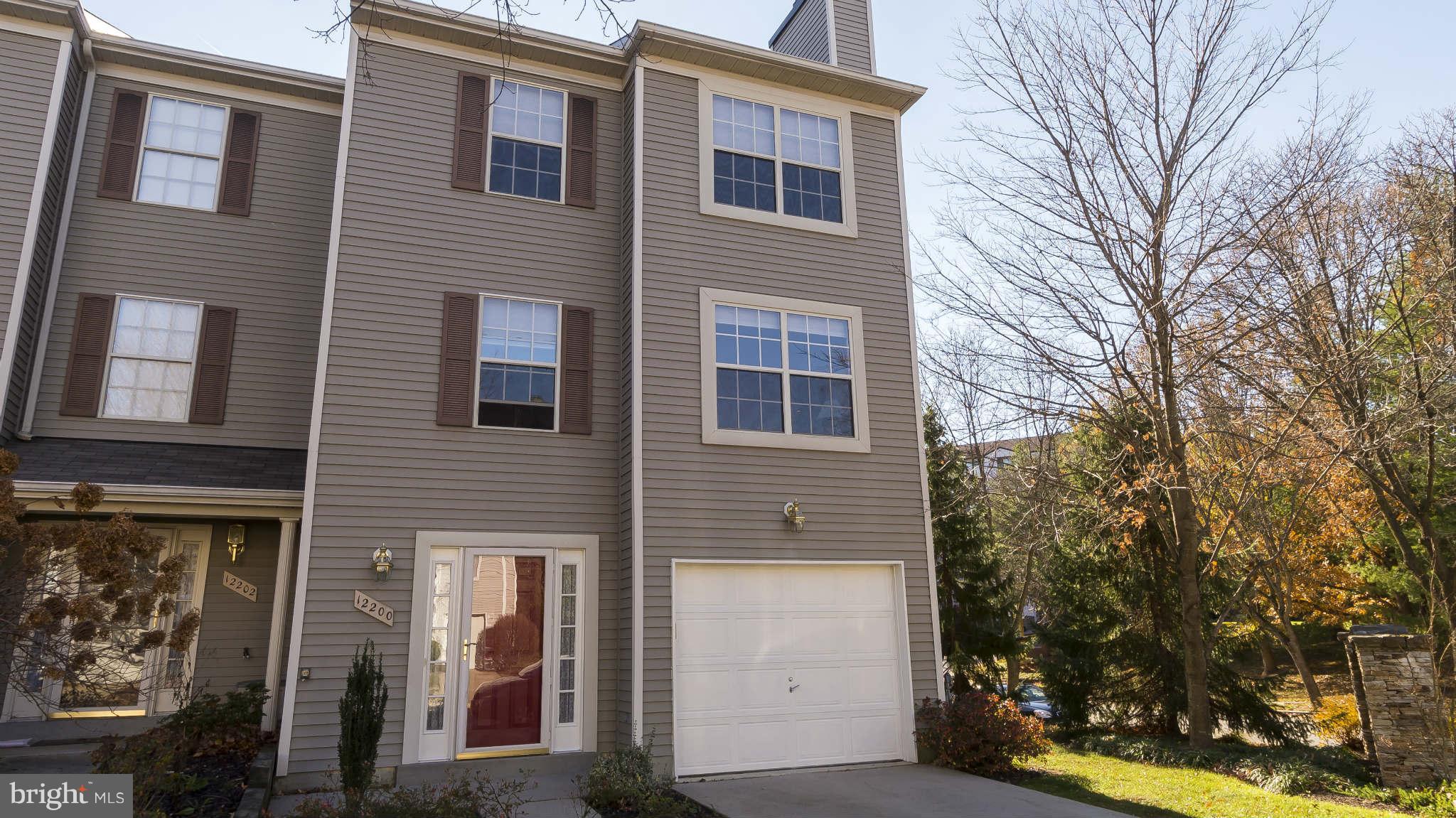 12200 Bare Bush Path Columbia, MD 21044 - Photo 1 of 30 a view of a brick house with a large windows