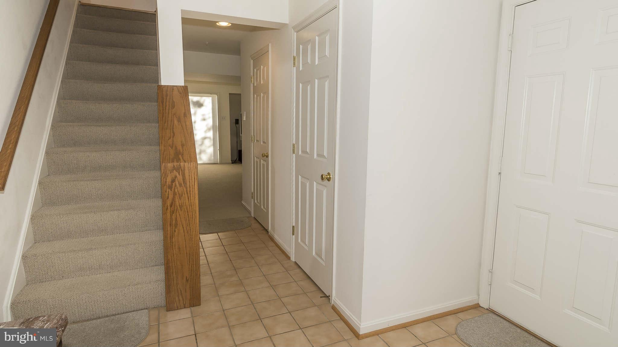 12200 Bare Bush Path Columbia, MD 21044 - Photo 2 of 30 a view of a hallway with a white walls