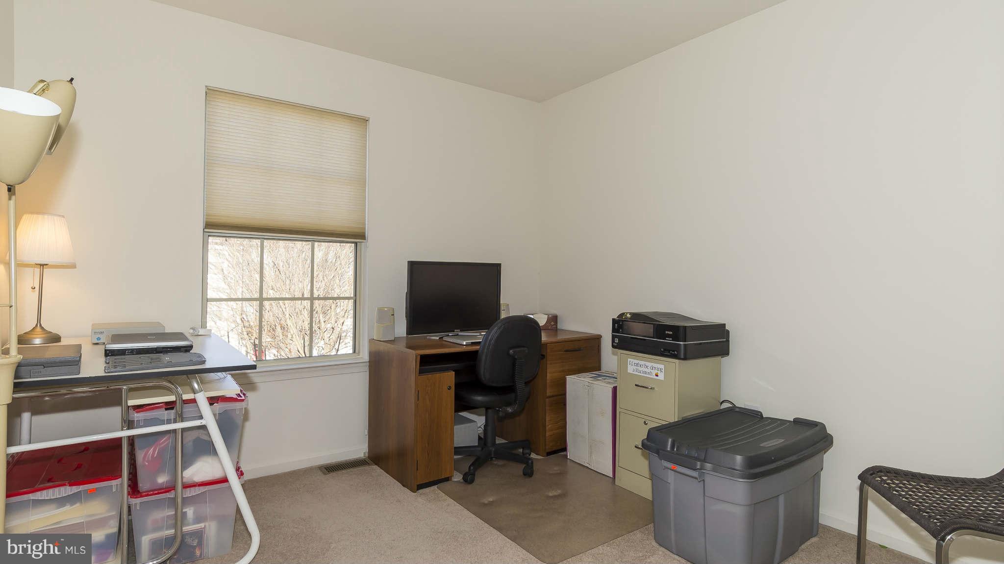 12200 Bare Bush Path Columbia, MD 21044 - Photo 22 of 30 a work room with furniture a flat screen computer and a window