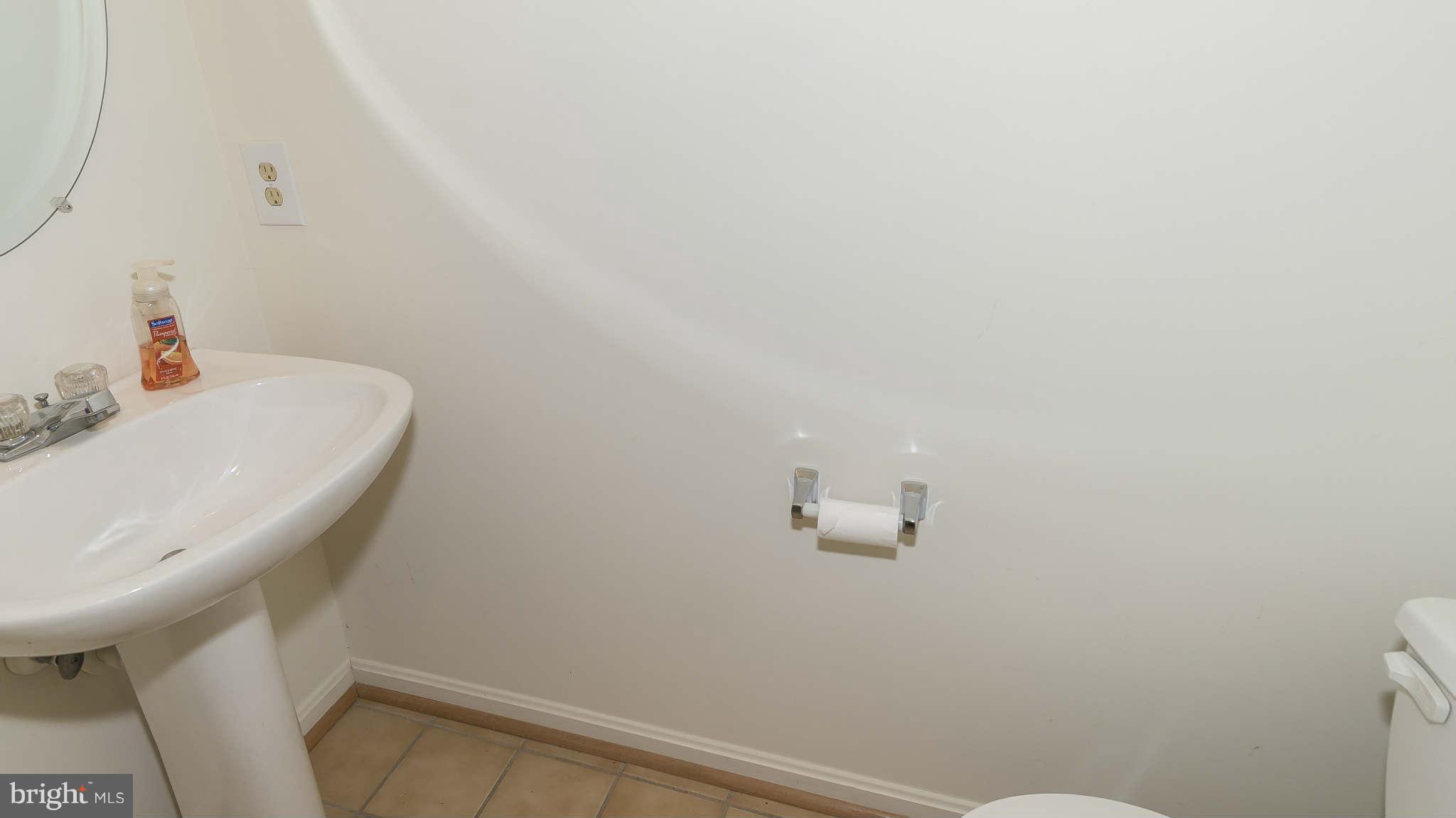 12200 Bare Bush Path Columbia, MD 21044 - Photo 26 of 30 a bathroom with a sink and toilet