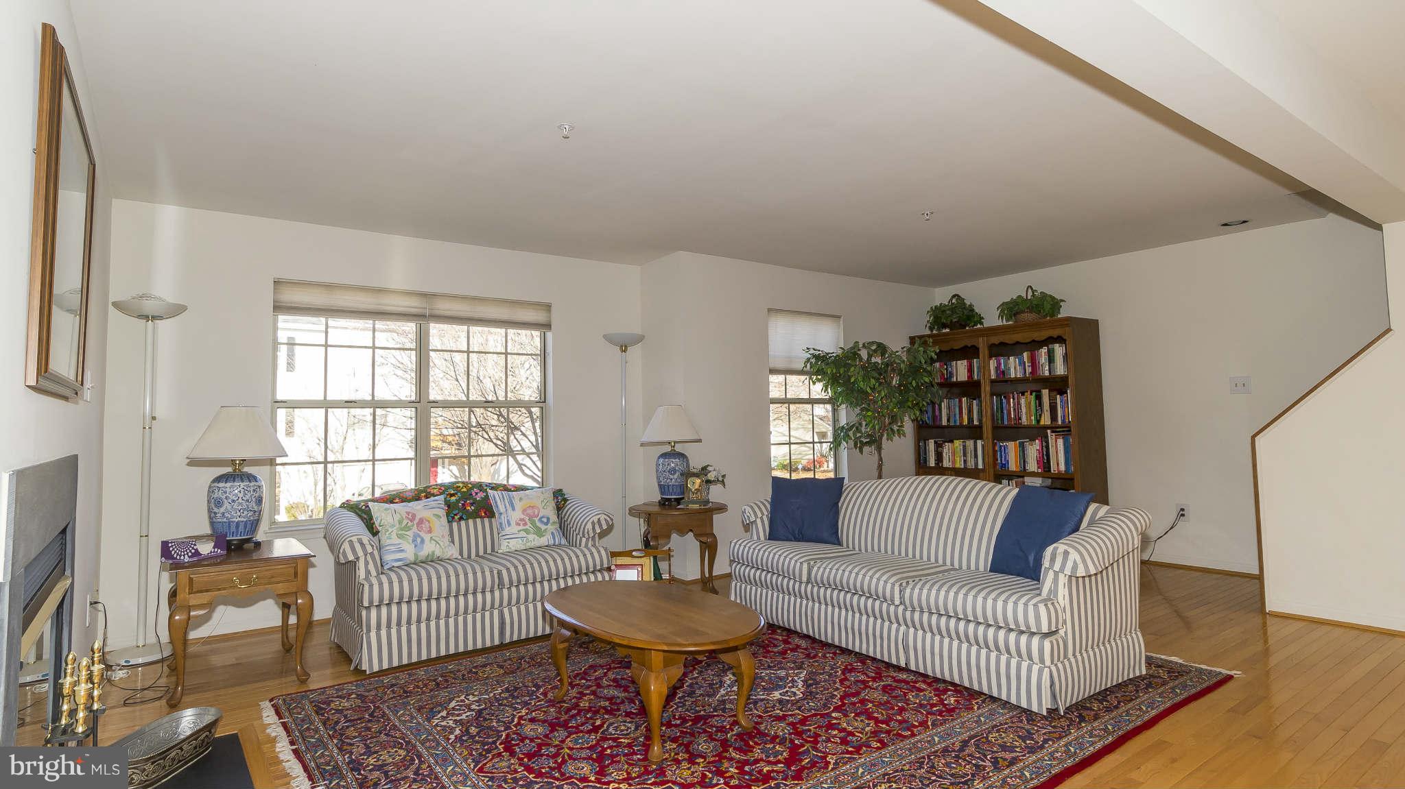 12200 Bare Bush Path Columbia, MD 21044 - Photo 4 of 30 a living room with furniture and a rug