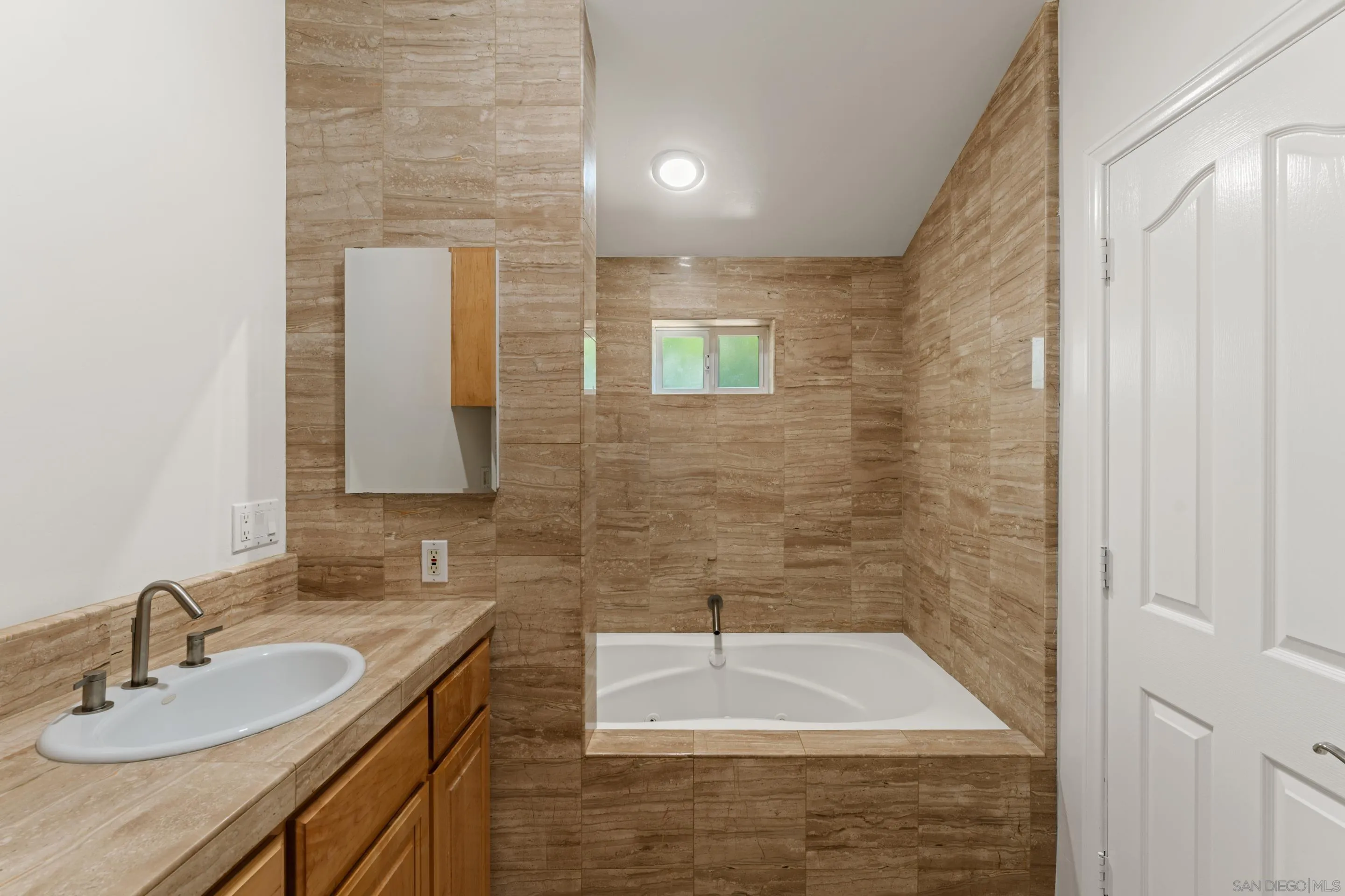 16611 Orchard Bend Road Poway, CA 92064 - Photo 28 of 59 a bathroom with a sink and a mirror