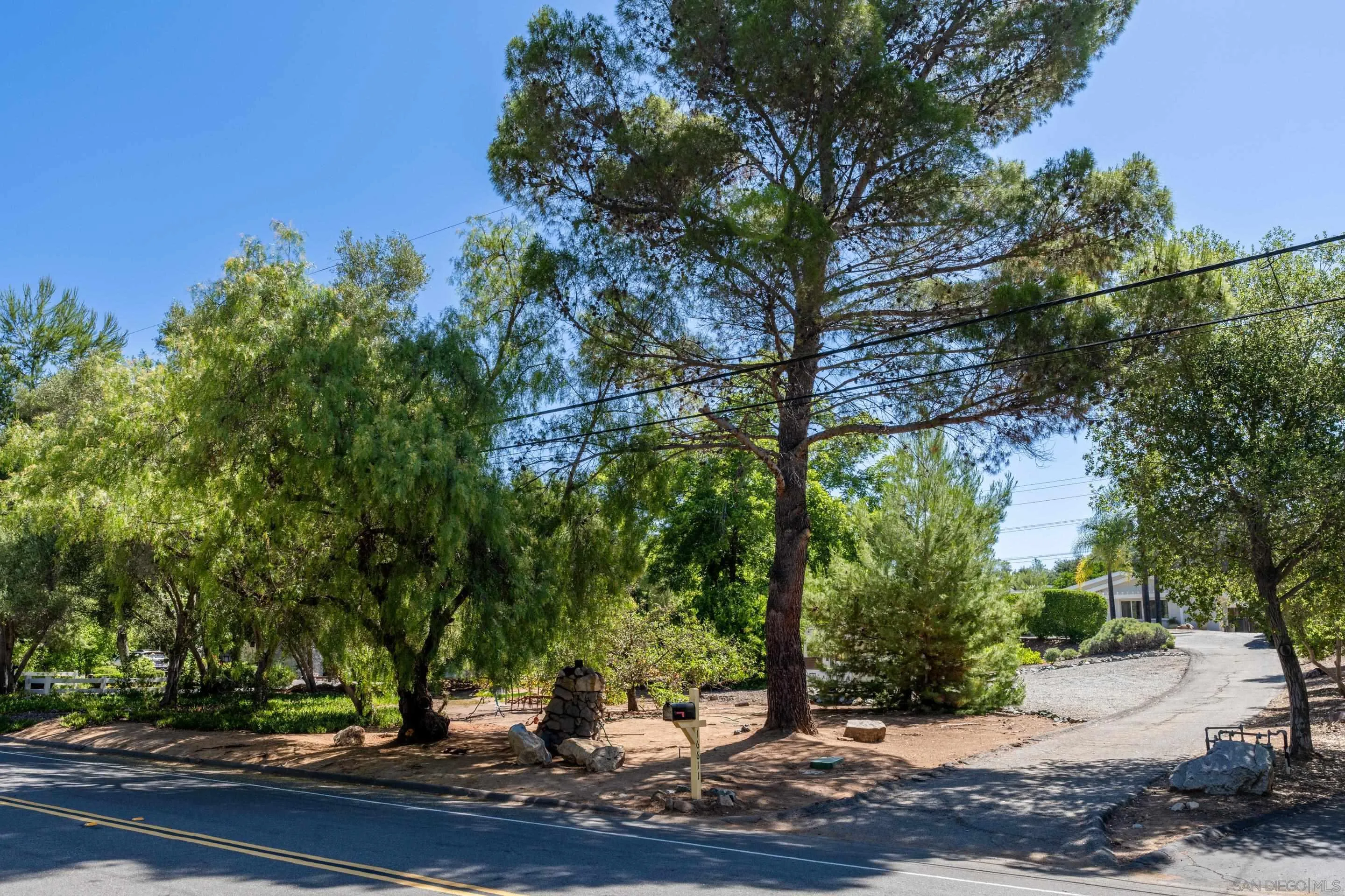 16611 Orchard Bend Road Poway, CA 92064 - Photo 46 of 59 a view of a tree in front of a house